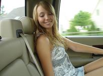 Cute smiling blonde in the car