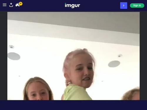 What is the name of the girl in the green top?