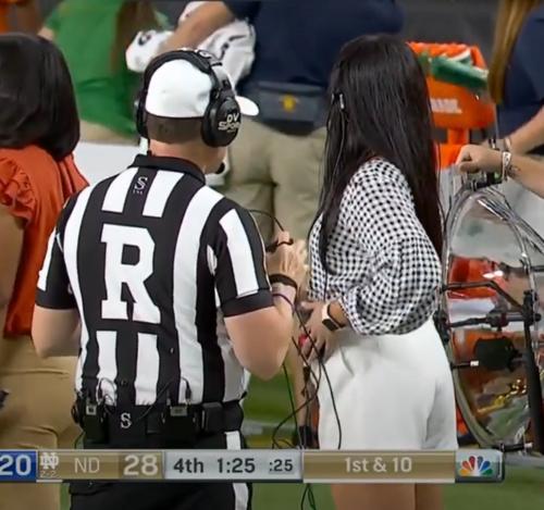 Who is the lady with white shorts at the end of the Notre Dame game?  