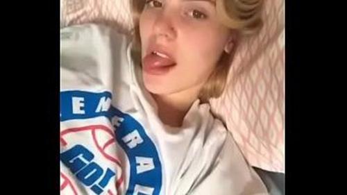 Blonde masturbating in bed and showing off her ass